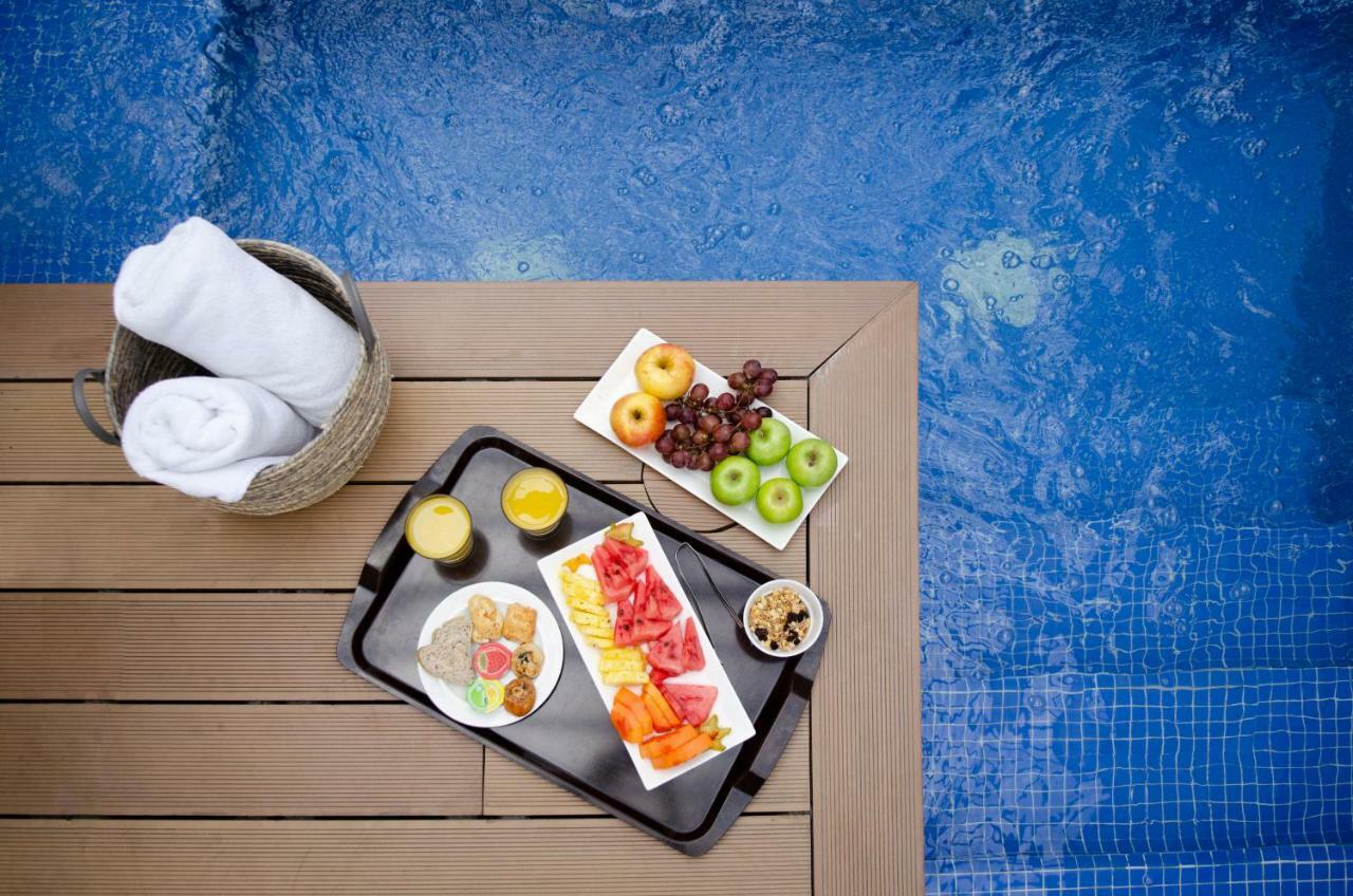 Quo Quality Hotel マニサレス エクステリア 写真 A poolside snack